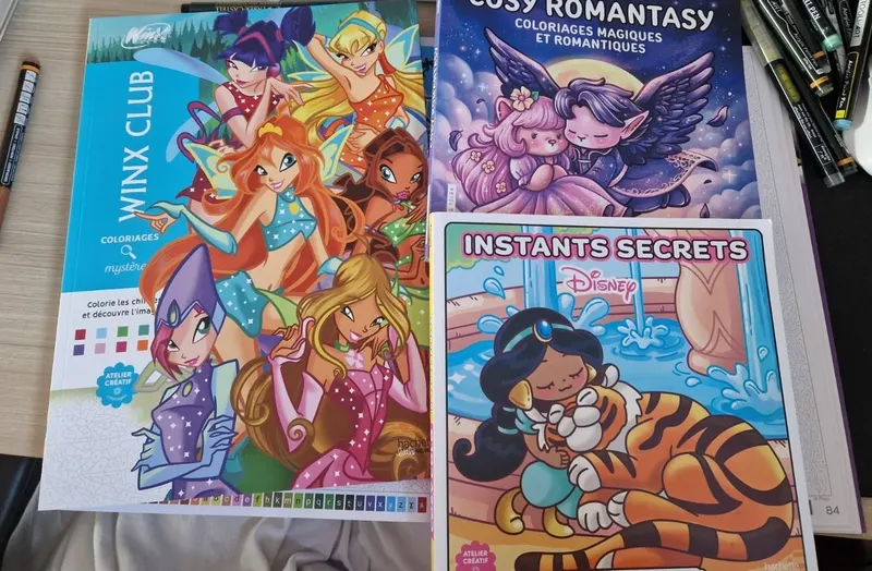 The three coloring books received on 5 August 2026, including the Winx Club mystery coloring book